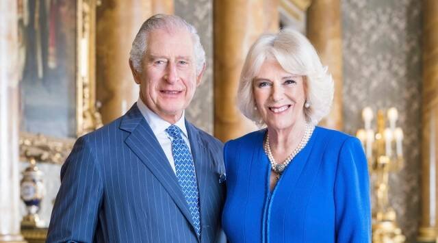 Britain's King Charles III and Camilla, the Queen Consort pose for a photo in the Blue Drawing Room at Buckingham Palace, London. (AP)
