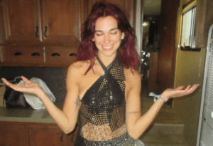 Dua Lipa’s Interaction with Ambitious Busker at Glastonbury Goes Viral