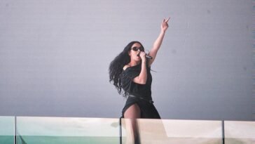 Charli XCX performing in Times Square, New York City ()