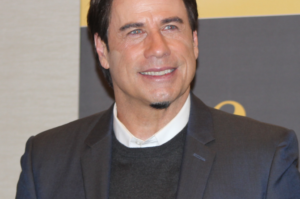 John Travolta Explains the Creative Intent Behind His Beret and Spectacles at the 2026 Cannes Film Festival